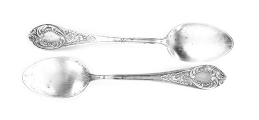 Metal spoons isolated on white
