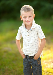 Portrait of cute little boy  in summer