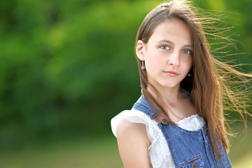 portrait of little girl outdoors in summer