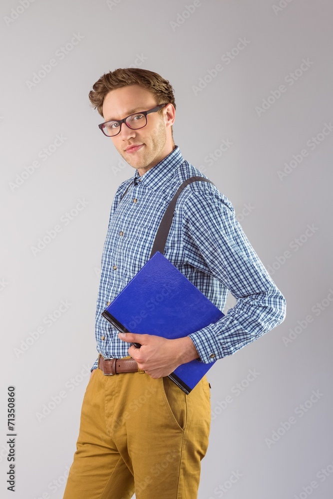Poster geeky student holding a notebook