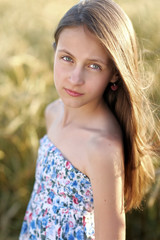 Fototapeta premium portrait of little girl outdoors in summer