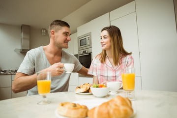 Cute couple having breakfast together