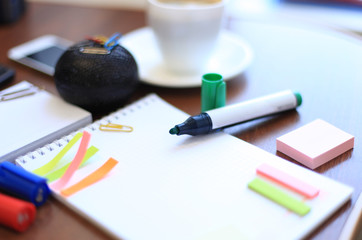 blank sheet and stationeries with cup of coffee on the table