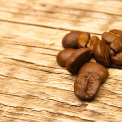 Coffee beans on old wooden table - 1 to 1 ratio