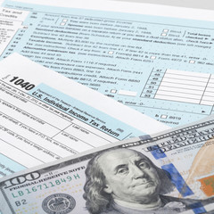 USA Tax Form 1040 with calculator and dollars - 1 to 1 ratio