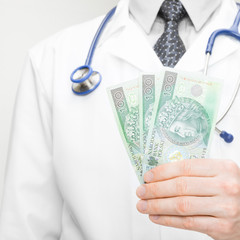 Doctor holding money in his hand - 1 to 1 ratio