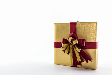 Gold and brown gift box with ribbon bow.