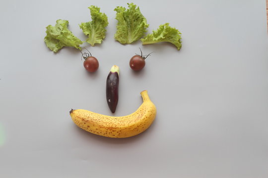 Vegetables are placed into the man's smile