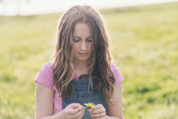 tween girl with daisy