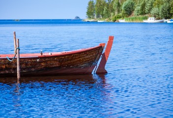 Fototapeta na wymiar Old fishing wooden rowboat