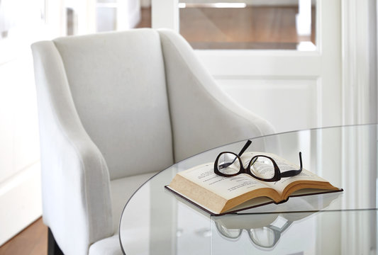 Living Room Armchair With Book And Eyeglasses