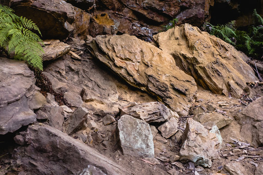 Two symmetrical orange sandstone bolders