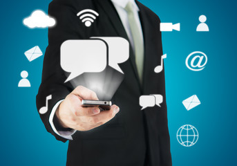 Businessman hand holding smart phone cloud connectivity