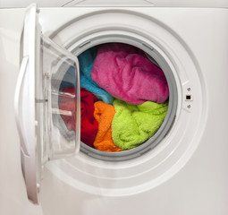 Wash machine with colored clothes inside