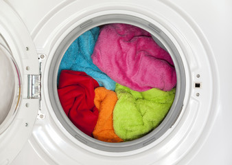 Wash machine with colored clothes inside