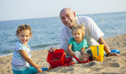 Happy little girls with dad