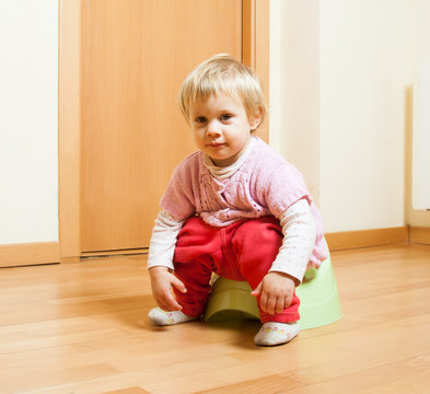 Toddler  on potty at home