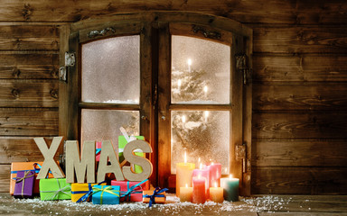Christmas Gifts and Candle Lights at Window