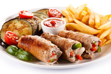 Wrapped pork chop, boiled potatoes and vegetables