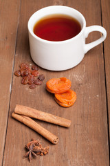 cup of tea on an old wooden table. small depth of field