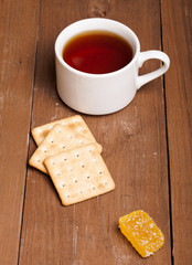 cup of tea on an old wooden table. small depth of field