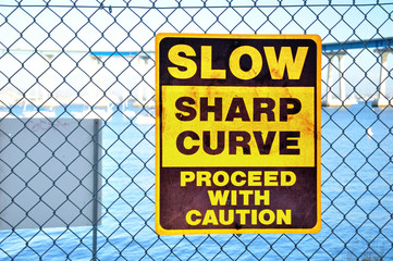 Warning signboard on the net fence. San Diego. USA.