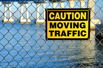 Warning signboard on the net fence. San Diego. USA.