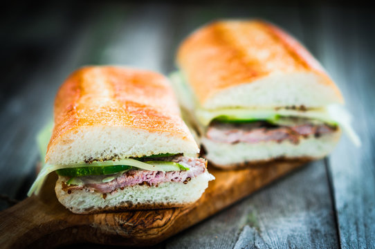 Cuban sandwiches on wooden background