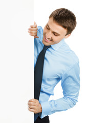 Businessman showing signboard, on white