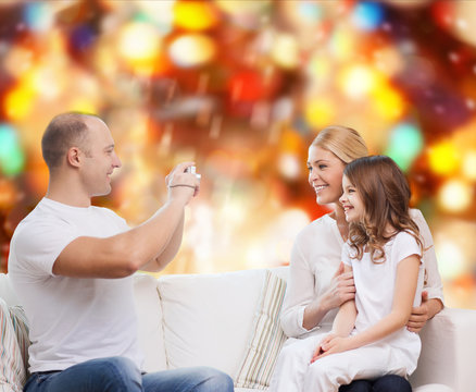 happy family with camera at home