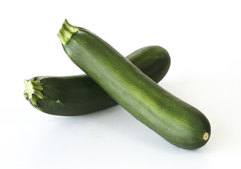 two courgettes on white background