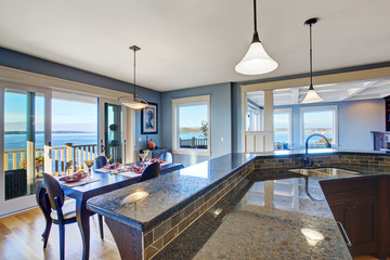 Luxury kitchen. Cabinet with granite top and tile trim