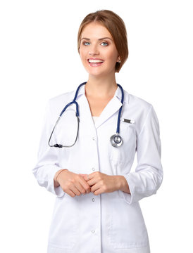 Portrait of young woman doctor with white coat standing in