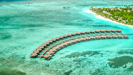 aerial view of irufushi island, bungalows and coast, maldives - obrazy, fototapety, plakaty