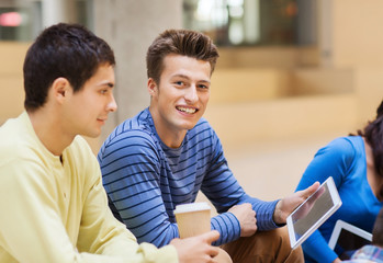 group of students with tablet pc and coffee cup