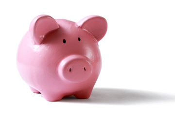 piggy bank with glasses in isolated white background