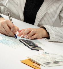 Business woman working with tax documents.