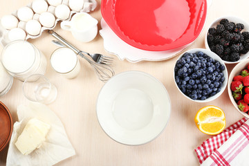 Baking tasty pie and ingredients for it on table in kitchen