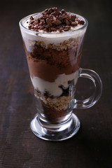 Yogurt, with chocolate cream, chopped chocolate and muesli