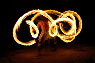 Fire show in famous Hina cave, blurred motion, Oholei beach, Ton
