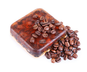 Organic soap with coffee beans, isolated on white