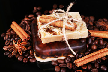 Organic soap with coffee beans and spices, on dark background