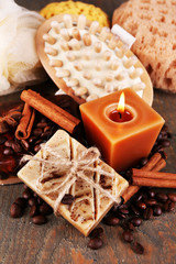 Fototapeta na wymiar Soap with coffee beans and spices, sponge and massage brush