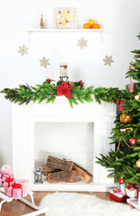 Fireplace with beautiful Christmas decorations in room