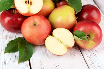 Ripe red apples on wooden background