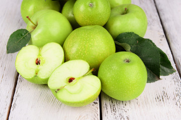 Ripe green apples on wooden background