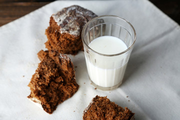 Rye bread and glass of milk on fabric background