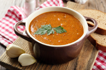 Delicious lentil cream-soup on table close-up