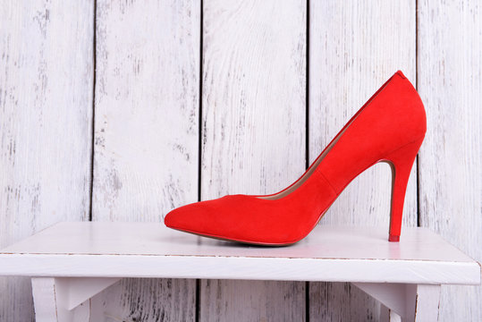 Red women shoes on wooden background