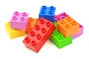 Toy colorful plastic blocks isolated on white background